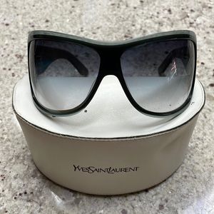 YSL wrap around style sunglasses, lenses tinted a greenish color